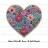 A heart-shaped patch featuring a dense floral design in shades of pink, purple, and blue.
