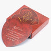A box of Lovers Oracle tarot cards and guidebook with a heart-shaped design.