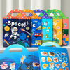 A hand holds an open reusable cartoon sticker book featuring marine organisms and space themes.