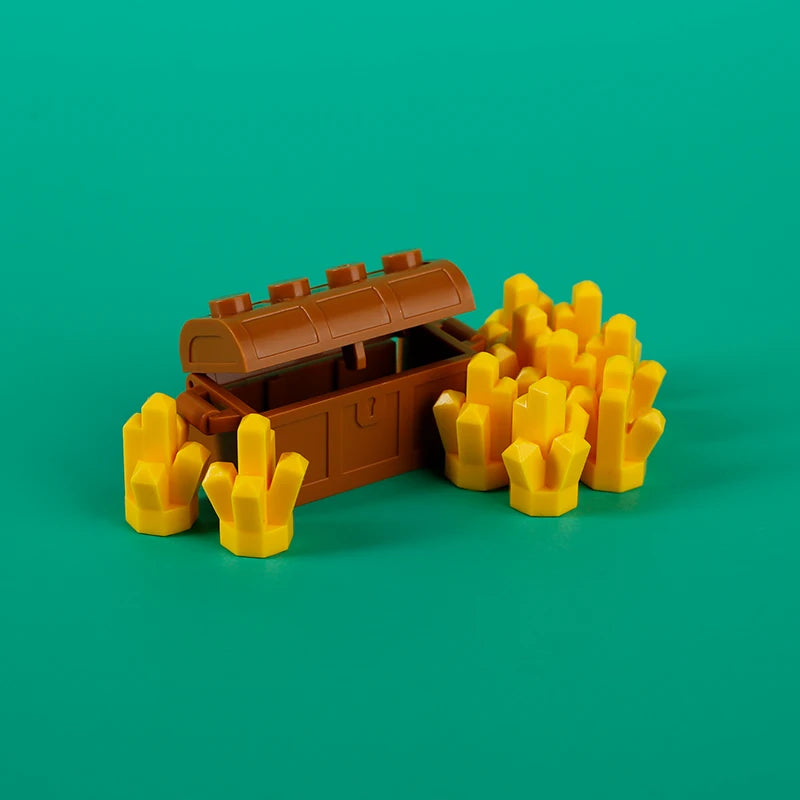 A brown building block treasure chest set with yellow and gold-colored building blocks.