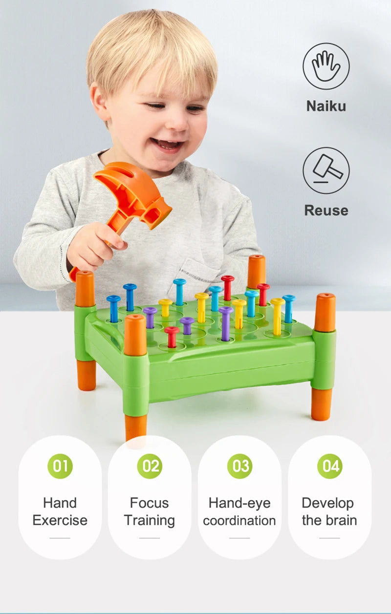 A toddler is playing with a green and orange toy hammer set for fine motor skills and color sorting.