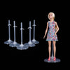 A blonde doll wearing a floral dress is displayed on a transparent stand with a waist clip.