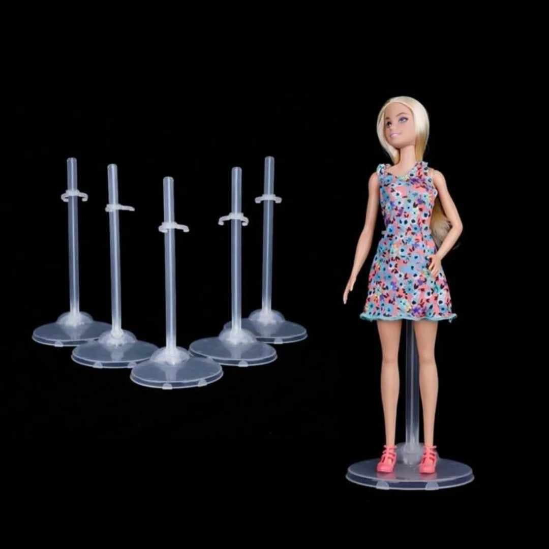 A blonde doll wearing a floral dress is displayed on a transparent stand with a waist clip.
