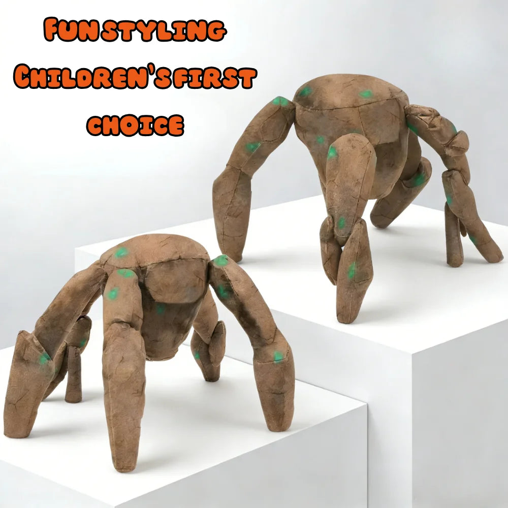 A brown soft plush toy resembling an alien or creature is displayed on a white pedestal.