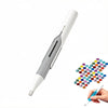 A white diamond painting pen with an automatic bead dispenser is shown being held by a hand.