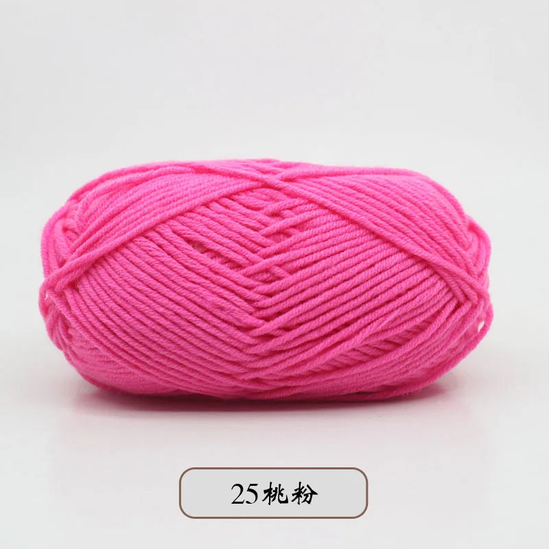 A ball of bright pink pre-dyed milk cotton yarn for knitting and crochet.