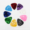 A circular arrangement of ten guitar picks in various colors including red purple blue and green