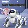 A white and blue robot dog with eight wheels is shown on a light purple surface.
