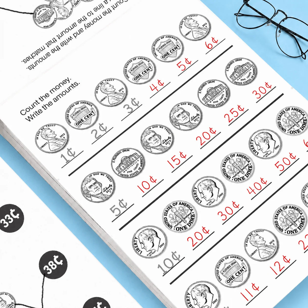A page from a money counting activity workbook showing various US coins and amounts for children.