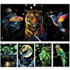 A collection of glow-in-the-dark scratch art featuring animals like a tiger, bird, fish, and lion.