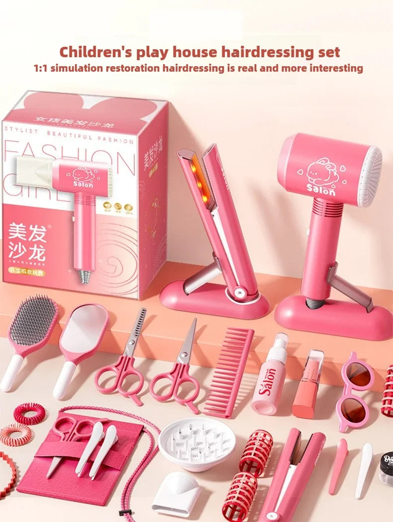 A pink children's hairdressing set featuring styling tools like blow dryers, scissors, and combs displayed on a box.