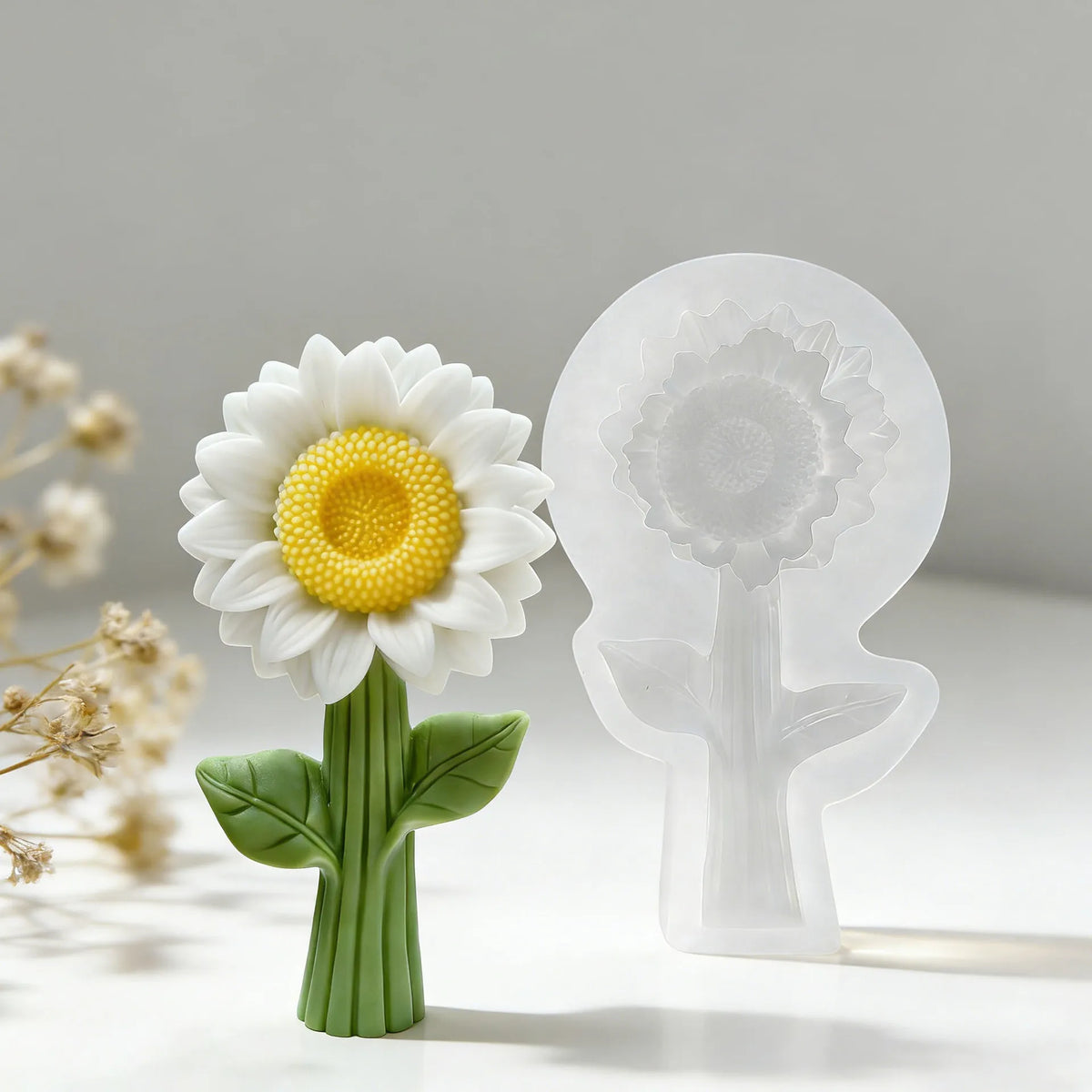 A white silicone mold shaped like a sunflower, used for candle making, resin, or soap.