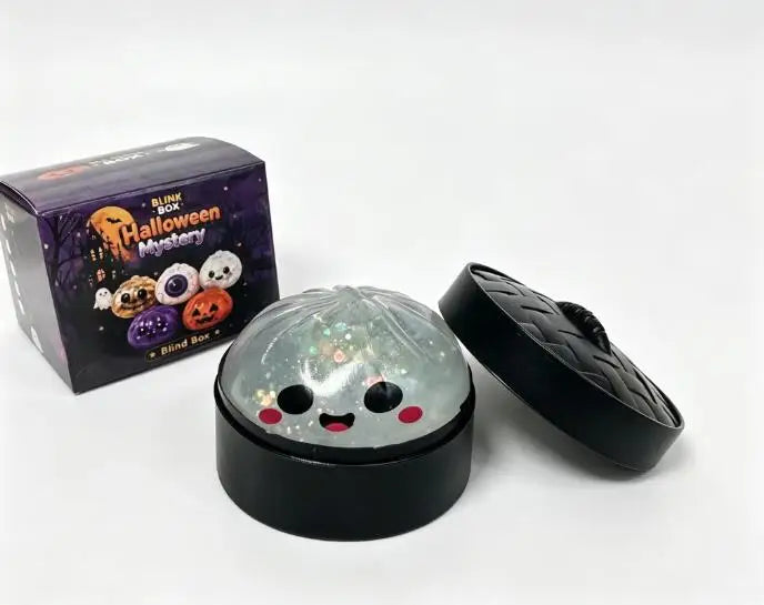 A black tin box and a clear Halloween-themed squishy stress relief toy are shown on a white background.