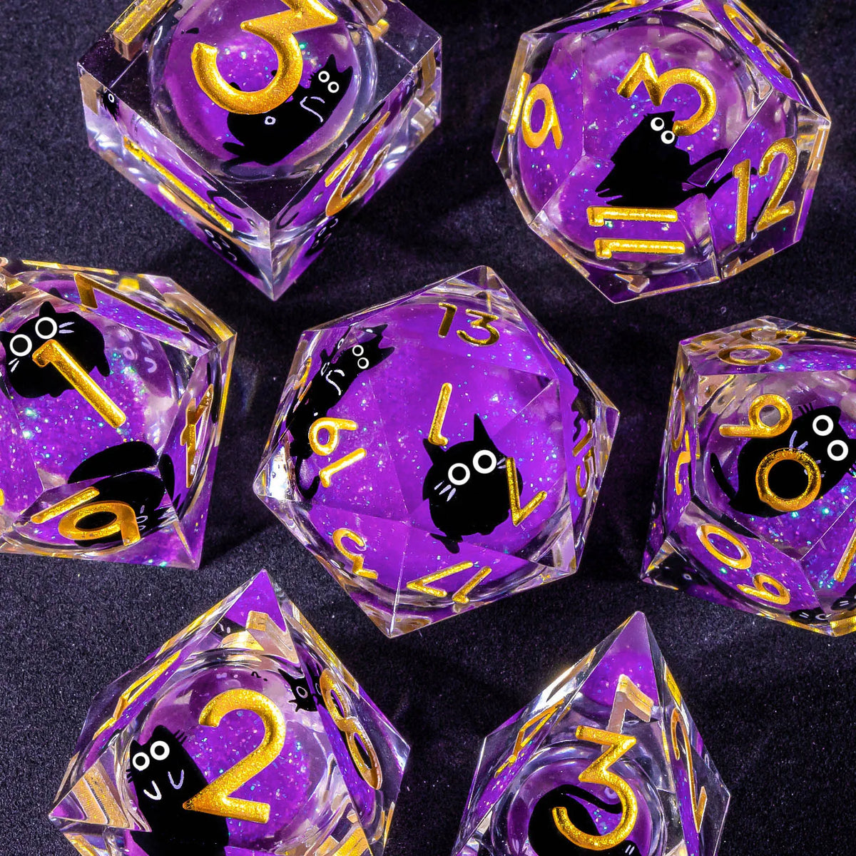A collection of handmade liquid core resin dice set in purple and gold, showing various numbers and symbols.