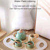A set of wooden pretend play tea party cups and teapot for water paint coloring.