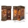 A wooden miniature kit of a retro magic wand shop with glass display cabinets and brick facade.