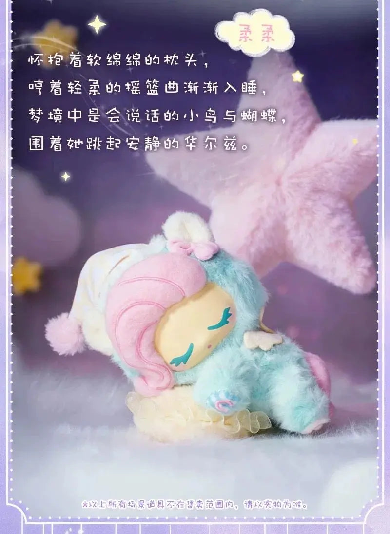 A soft blue and pink My Little Pony figure with a light purple mane is displayed against a lavender background.