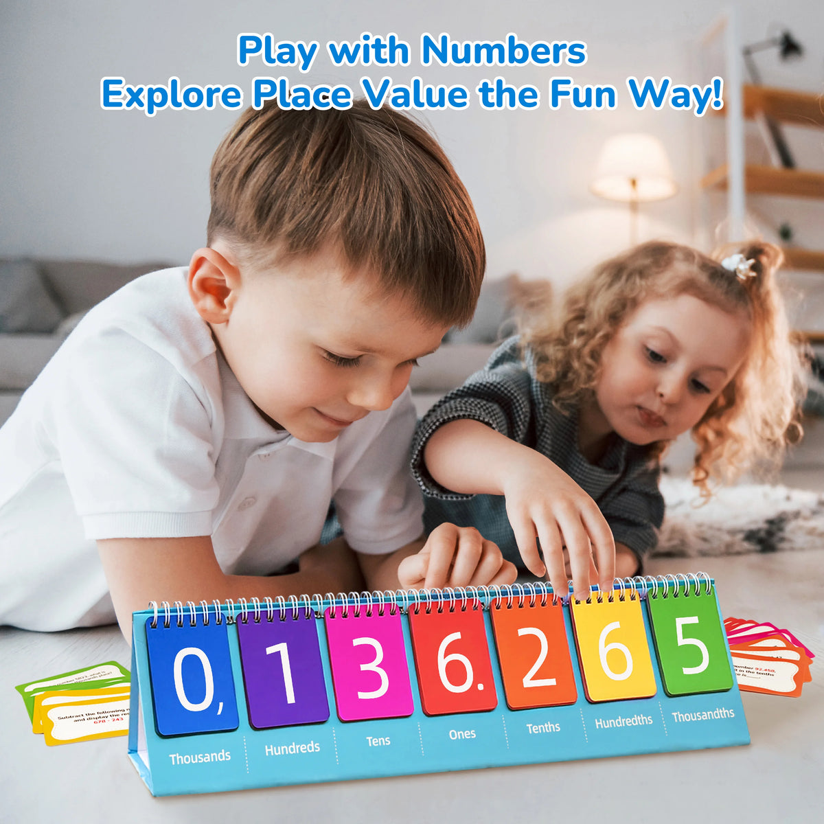 A child is playing with a set of colorful place value flash cards showing numbers from zero to six.