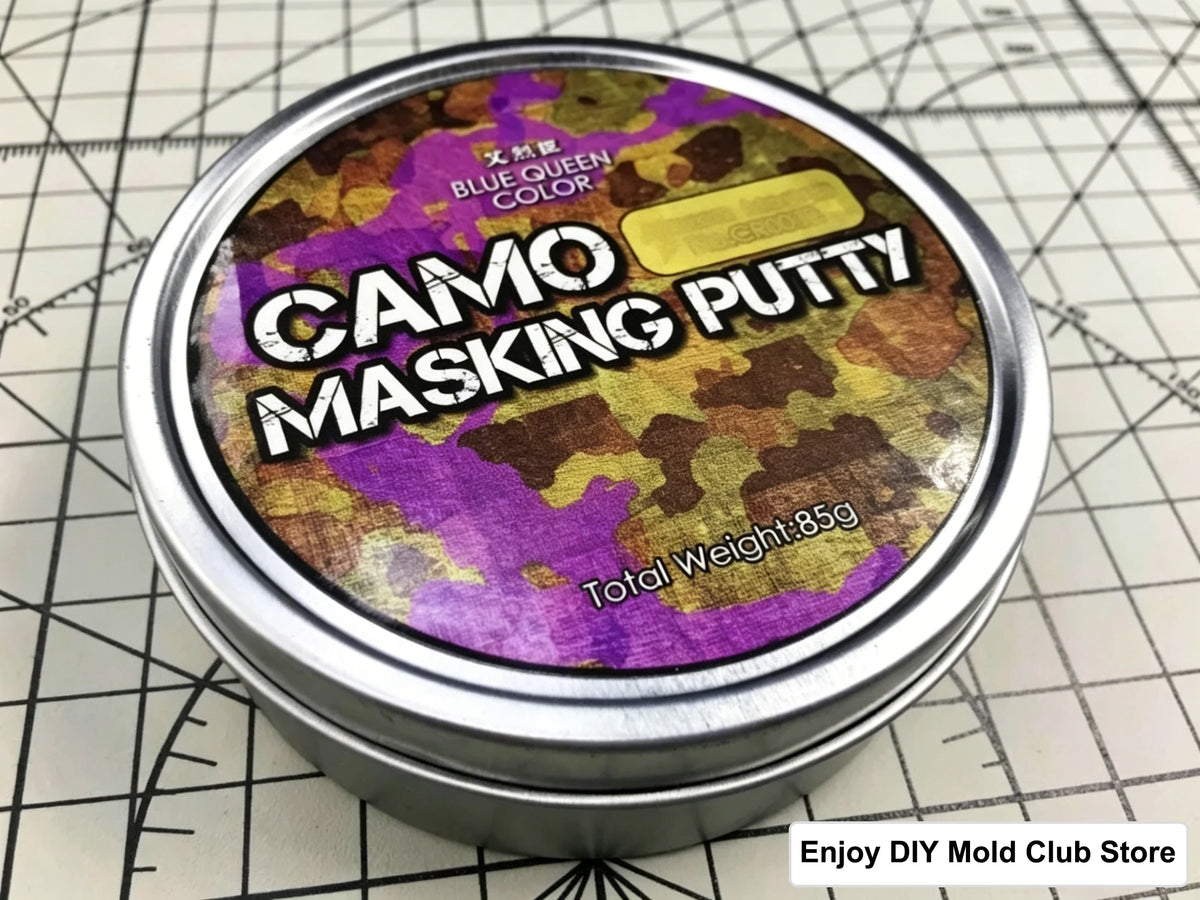 A tin of Camo Masking Putty with a camouflage pattern and the text Blue Queen Color