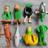 A collection of eight quirky wooden stick doll figures in various colors and styles.