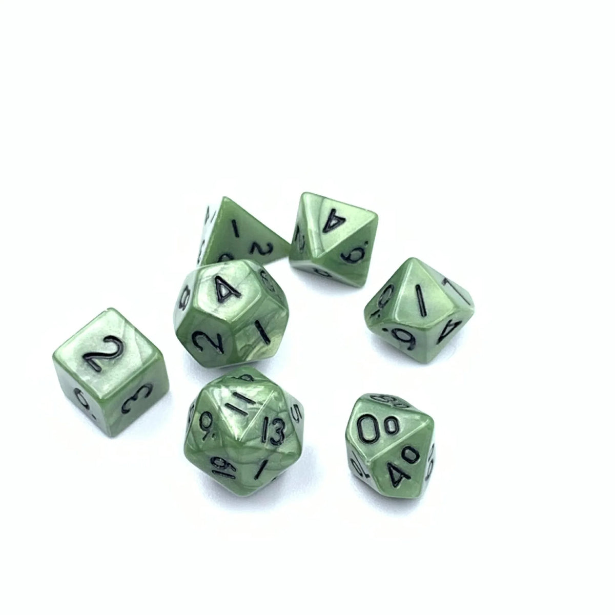 A collection of seven transparent acrylic D6 dice showing various numbers and colors.