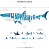 A banner featuring a shark silhouette spelling out HAPPY BIRTHDAY, along with separate geometric shark pieces for a garland s