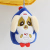 A plush pendant doll of a dog character with blue and white fur and gold accents.