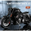 A black vintage die-cast motorcycle model is shown in a studio setting.