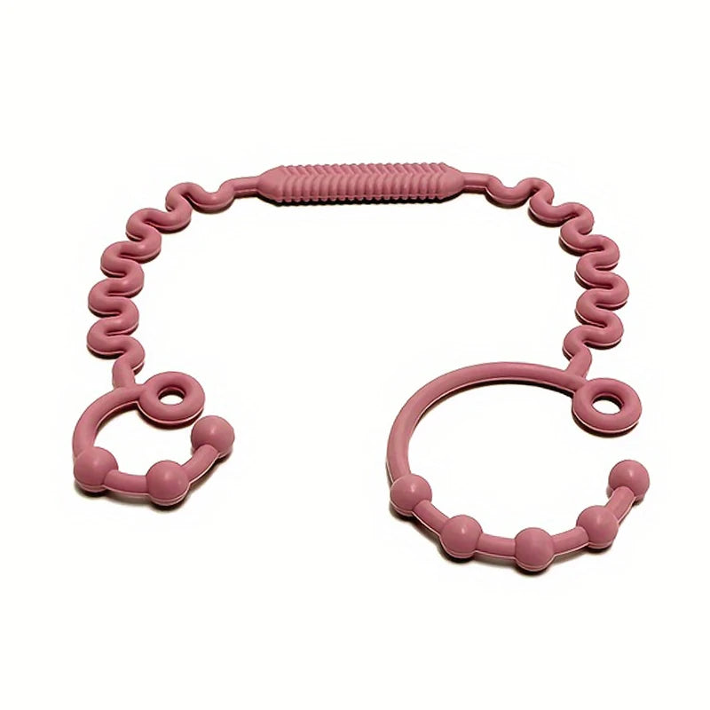 Pacifier anti-chute en silicone rose avec une texture et des anneaux flexibles.