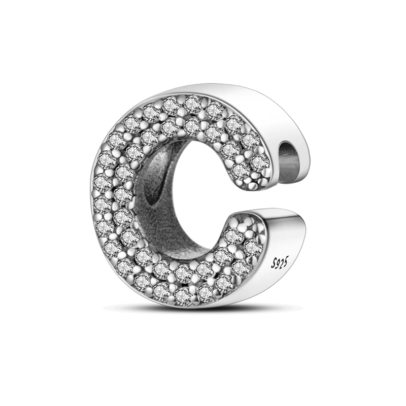A sterling silver alphabet charm shaped like the letter C, encrusted with small cubic zirconia stones.