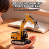 A yellow 1:64 scale mini RC excavator is held in a person's hand on a wooden surface.