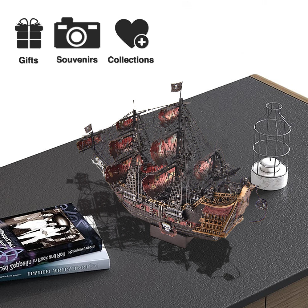 A detailed metal 3D puzzle model of the ship Queen Anne's Revenge displayed on a dark surface.