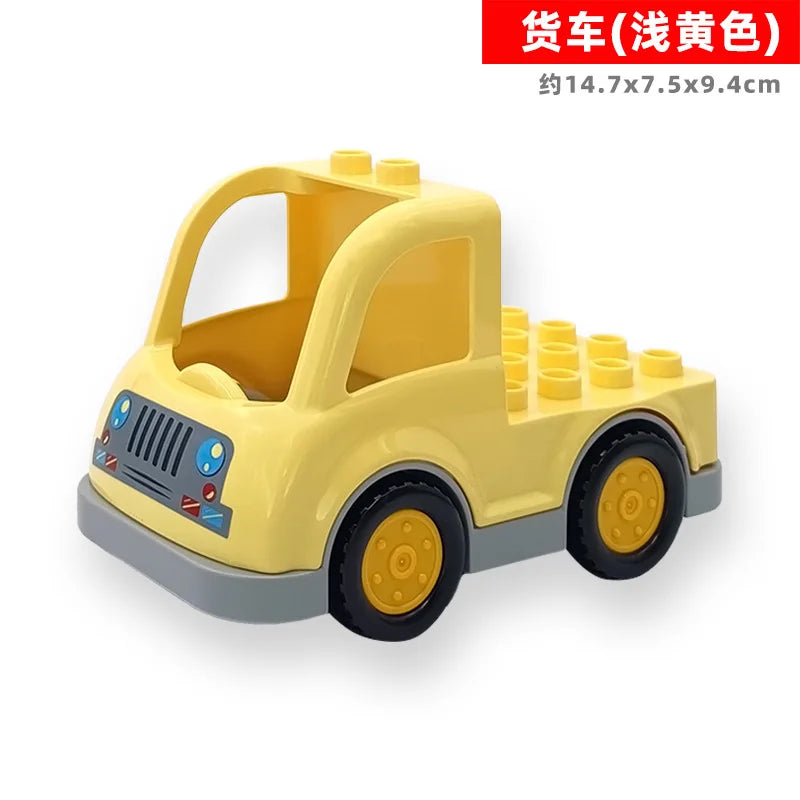 Yellow LEGO-style toy truck with a trailer, featuring a cab and wheels.