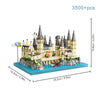 A detailed medieval castle building block set featuring stone towers and battlements on a blue base.