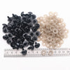 A collection of black and clear plastic safety eyes for amigurumi, including locking washers.