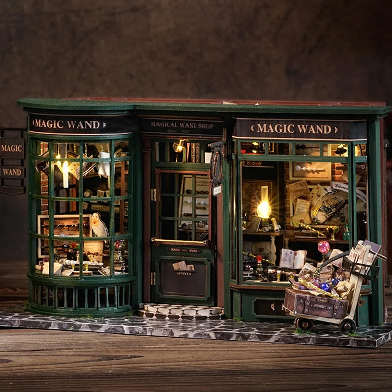 A display of a miniature magical wand shop featuring antique glass cabinets and wooden furniture.