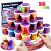 A hand is squeezing colorful galaxy slime party favors in small containers.