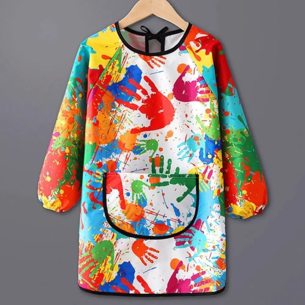 Kids waterproof long-sleeve art smock and dining bib featuring a colorful paint splatter design
