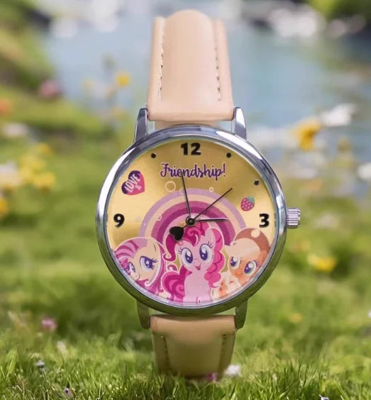 A pink My Little Pony themed watch with a light pink strap and a colorful face featuring pony characters.
