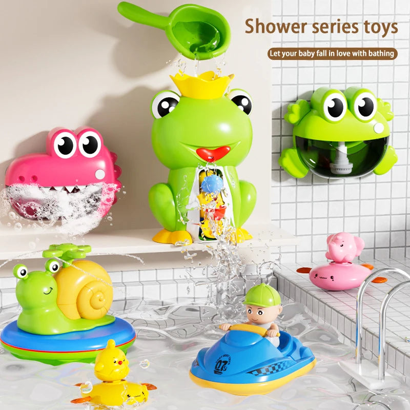 A collection of frog-themed bath toys including a large green frog, pink frog, and yellow floating toys.
