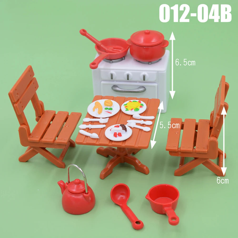 A dollhouse furniture playset featuring a mini kitchen with pots and pans, a wooden table, and small red cooking utensils.