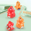 A set of orange and red animal racing cars with electric tracks and slides on a green track.