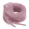 A roll of 3cm wide flat elastic silk lace shoelaces in a dusty mauve color.