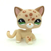 A small, light brown and orange spotted cat figure from the Littlest Pet Shop style collection.