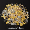 A pile of random mixed metal charms including stars, leaves, and various decorative elements for DIY jewelry making