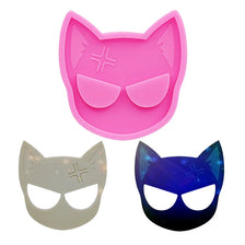 Three silicone cat head molds in pink, white, and blue for DIY keychains and craft projects
