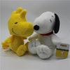 A yellow and white plush set featuring Snoopy and Woodstock characters.
