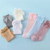 A collection of baby girl lace knee socks with bows in various pastel colors including white, pink, blue, and beige.