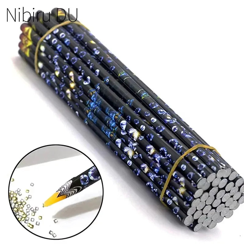 A cylindrical pen with numerous small, dark blue and gold rhinestones is shown alongside a close-up of the tip.