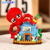 A set of ocean animal building blocks featuring a red crab, a yellow shark, and a blue clownfish.